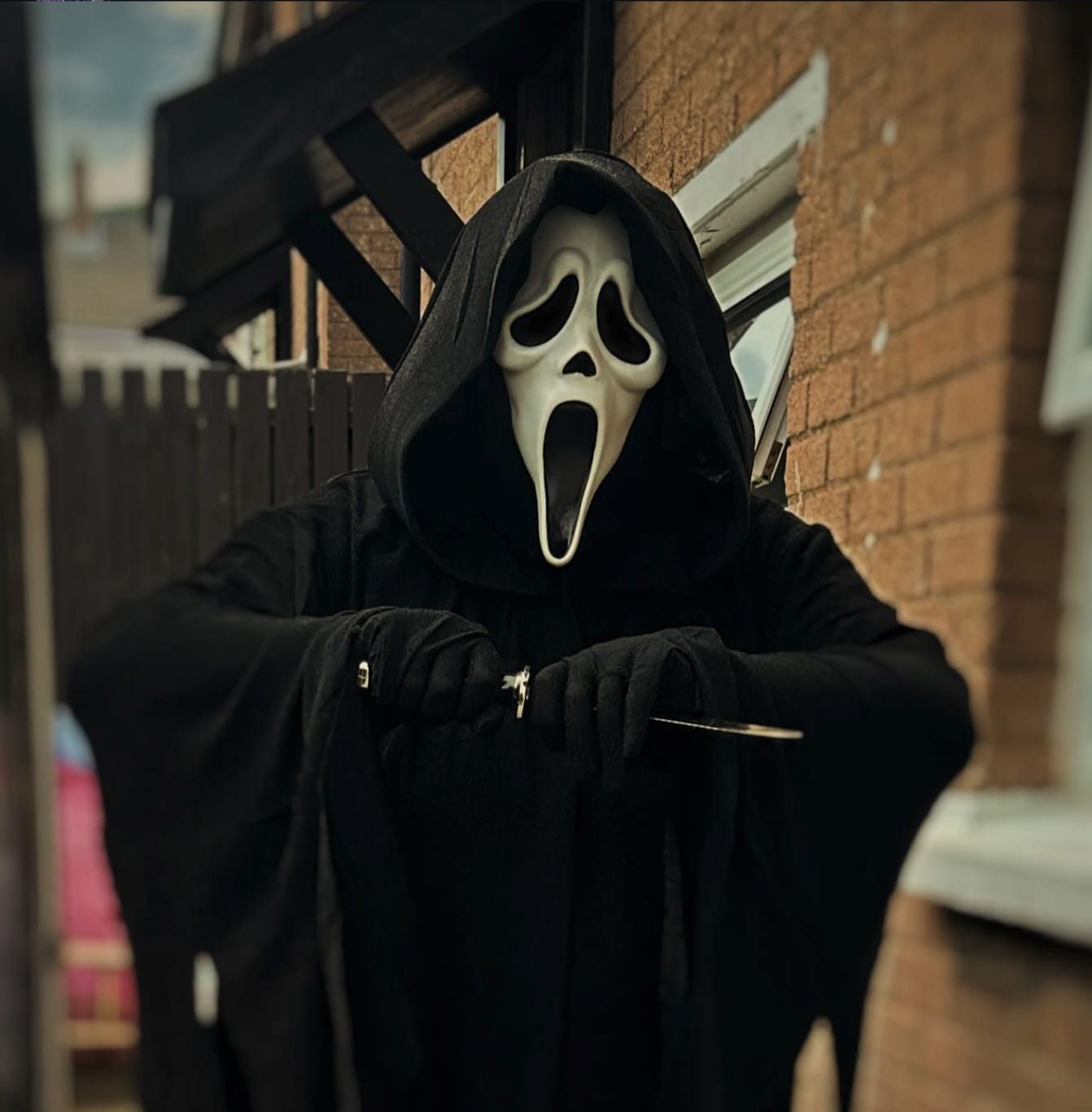 Ghostface-inspired doorstep portrait